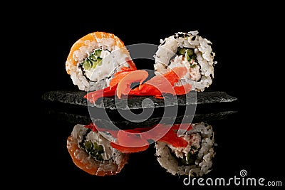 Sushi set with a piece of ginger on a graphite board Stock Photo