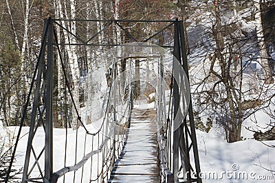 Suspended bridge over the Belakurikha River in resort area of the city of Belokurikha, Altai Territory, Russia Stock Photo