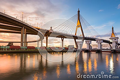 Suspension bridged river front with sunset Stock Photo