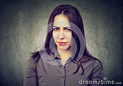 Suspicious doubtful young woman Stock Photo