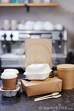 Sustainable Recyclable Takeaway Food Packaging On Counter In Coffee Shop Stock Photo