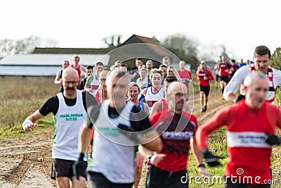 Sutton, Suffolk, UK December 15 2019: A adults over 18 cross country running race through a muddy countryside course Editorial Stock Photo