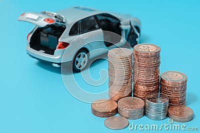 Auto loan: interest rates, car with open boot, blue background Stock Photo