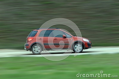 Suv driving on country road Stock Photo