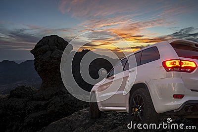 SUV driving on mountain off-roads Stock Photo