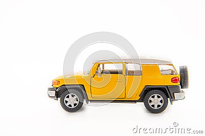 Suv yellow toy car toyota landcruiser Stock Photo