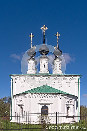 Church of the Entry into Jerusalem 1707 with black domes and crosses shining in the spring sun. Suzdal, Golden Ring of Russia Editorial Stock Photo