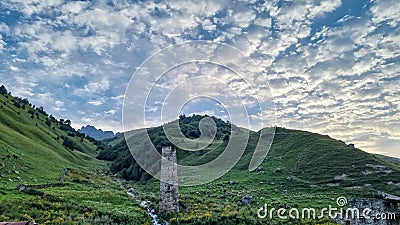 Svaneti - Svan watch tower next to a river located in the Greater Caucasus Mountain Range in Georgia. Stock Photo