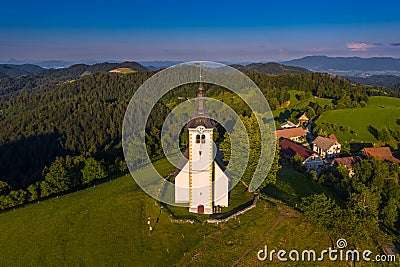 Sveti Andrej, Slovenia - Aerial drone view of Saint Andrew church Sv. Andrej at sunset in Skofja Loka area Stock Photo