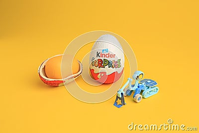 Sveti Vlas, Bulgaria - July 3, 2023: Kinder Surprise Eggs, plastic capsule and toy on yellow background Editorial Stock Photo