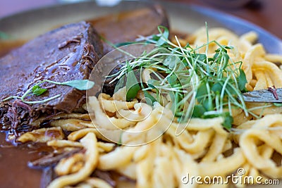 Swabian spÃ¤tzle with Sauerbraten Stock Photo