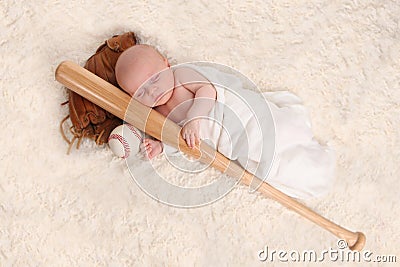 Swaddled Sleeping Baby Boy With a Baseball Bat Stock Photo