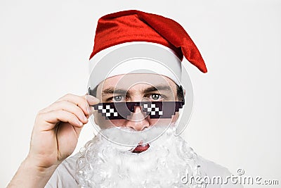 Swag Santa Claus in funny pixelated sunglasses on white background. Gangster, boss, thug life meme. 8bit style. Holly Jolly x Mas Stock Photo