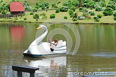 Swan pedal boat on the lake in a farm hotel, country side of Brazil Editorial Stock Photo