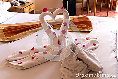 Swans from two towels on the bed of a room in an egypt hotel Stock Photo