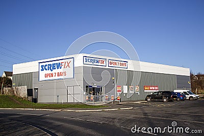 Screwfix shop front with car park and blue sky background Editorial Stock Photo
