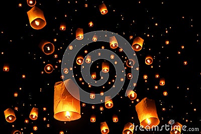 Swarms of sky floating lanterns are launched into the air during New year`s eve and Yee Peng lantern festival traditional at Stock Photo