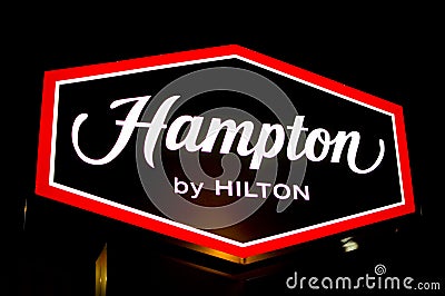 Swarzedz, Poland - December 2022: Hampton by Hilton hotel signboard Editorial Stock Photo