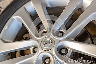 Swat, Pakistan - May 19 2023: Nissan vehicle alloy wheel rim with nissan brand logo. selective focus Editorial Stock Photo