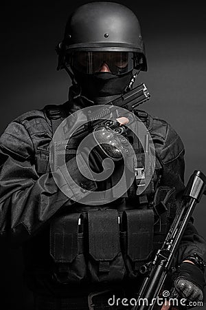 SWAT police officer with pistol Stock Photo