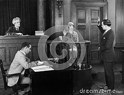 Swearing in witness in courtroom Stock Photo