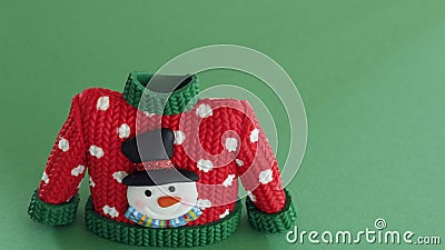 Red christmas sweater with green collar and sleeve cuffs Stock Photo