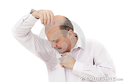 Sweaty spot on the shirt because of the heat, worries and diffidence. Stock Photo