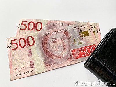 Sweden krone bills with black leather wallet isolated on white background. Swedish krona. Stock Photo