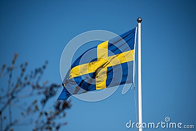 Swedish flag on a flag pole Stock Photo