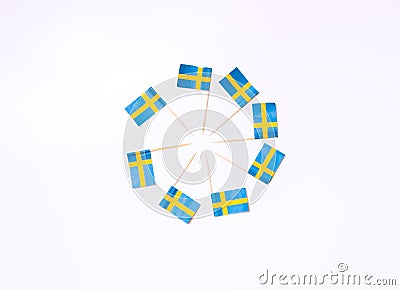 Swedish flags in the shape of circle on the white background. Swedish flag concept. Scandinavian Stock Photo