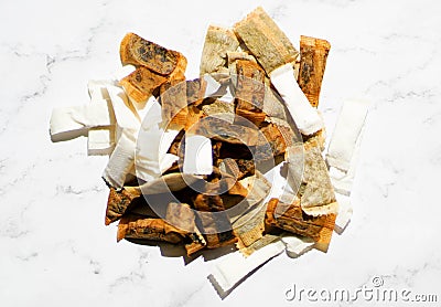 Swedish snus chewing tobacco on a white granite background Stock Photo