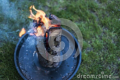 Swedish torch fire burning stub on plate for rest or to cook food chill mood Stock Photo