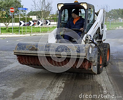 Sweeper attachments mini excavator. Stock Photo