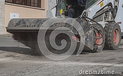 Sweeper attachments mini excavator. Stock Photo