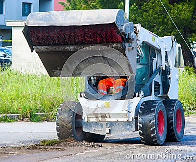 Sweeper attachments mini excavator Stock Photo
