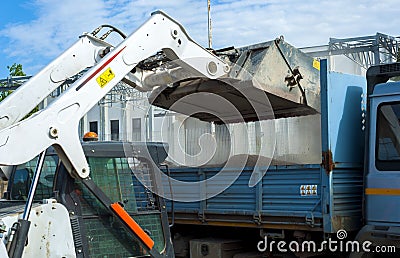 Sweeper attachments mini excavator. Stock Photo