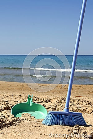 Sweeping the beach (irony) Stock Photo