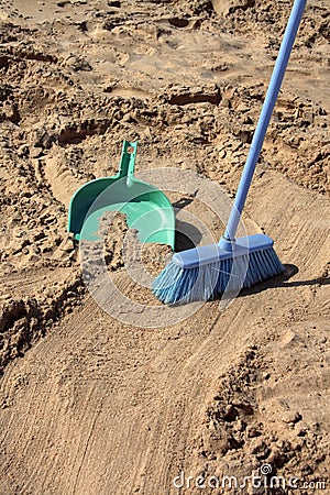 Sweeping the beach (irony) Stock Photo