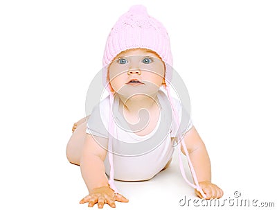 Sweet baby crawls in knitted hat Stock Photo