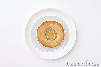 Sweet bakery at a round plate isolated at white background. Pastry image. Jam topping Stock Photo