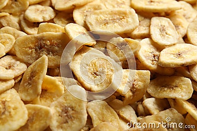 Sweet banana slices as background. Dried fruit Stock Photo