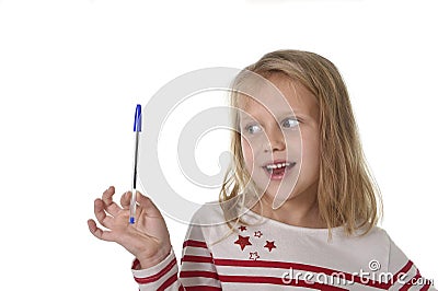 Sweet beautiful female child 6 to 8 years old holding ball pen school supplies concept Stock Photo