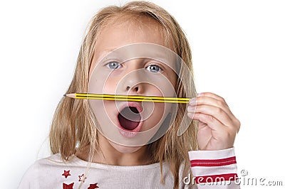 Sweet beautiful female child 6 to 8 years old holding pencil school supplies concept Stock Photo