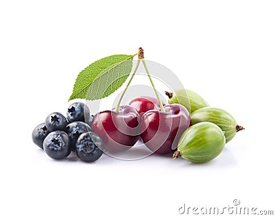 Sweet berries of blueberries,cherry and goosberry on white backgrounds Stock Photo