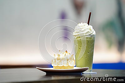 Sweet and beverate; Ice lemen tea and ice milk green tea with crown pie cake Stock Photo
