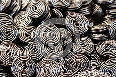 Sweet black candy spiral background Stock Photo