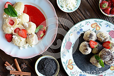 Sweet boiled dumplings filled with strawberries with a poppy seed sauce and curd Stock Photo