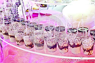 sweet buffet on a pink table in a party Stock Photo