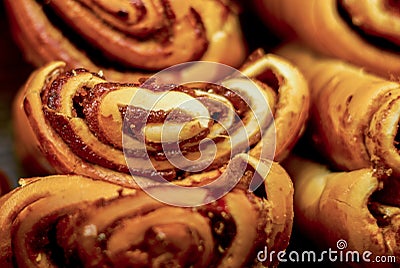 Sweet buns. Freshly baked buns on a dark background. Stock Photo