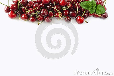Sweet cherry berries on white background cutout. Cherry fruit at border of image with copy space for text. Stock Photo